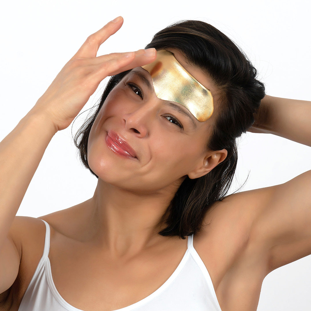 women wearing a forehead patches to reduce wrinkles and fine lines