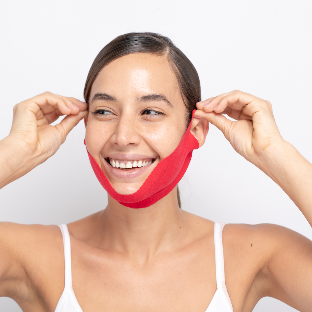 a girl wearing double chin reducer, chin lift mask, chinstrap for double chin, double chin masks that works, double chin remover, how to get rid of double chin fat, jawline mask, best jawline products, chin sagging, double chin face lift, chin slimmer, double chin remover, double chin treatment